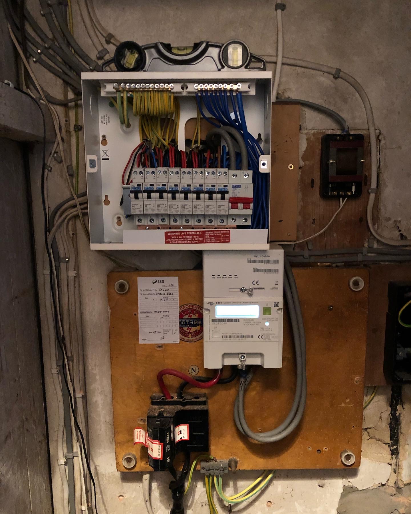 Modern consumer unit during an EICR inspection